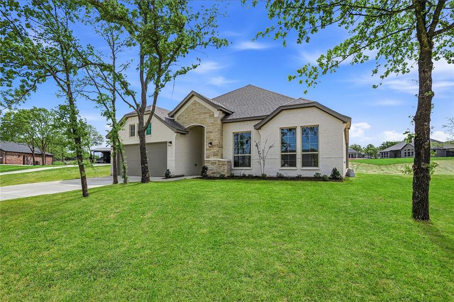 Front exterior of a new home in Arbor Oaks, Boyd, TX, highlighting curb appeal (Image 26).