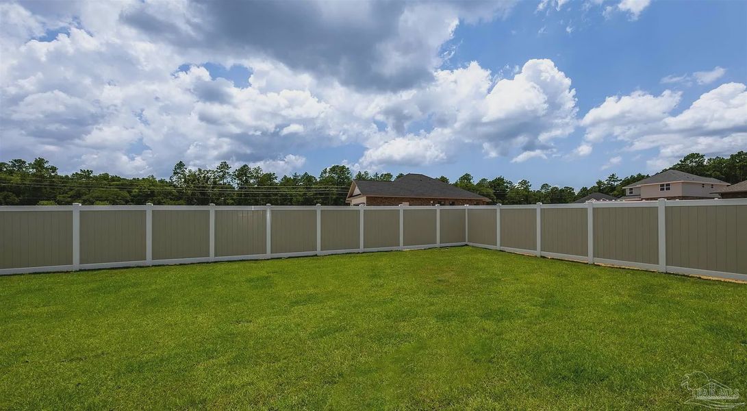 Exterior details and patio area of a home in Parkland Place, Pace (Image 18).