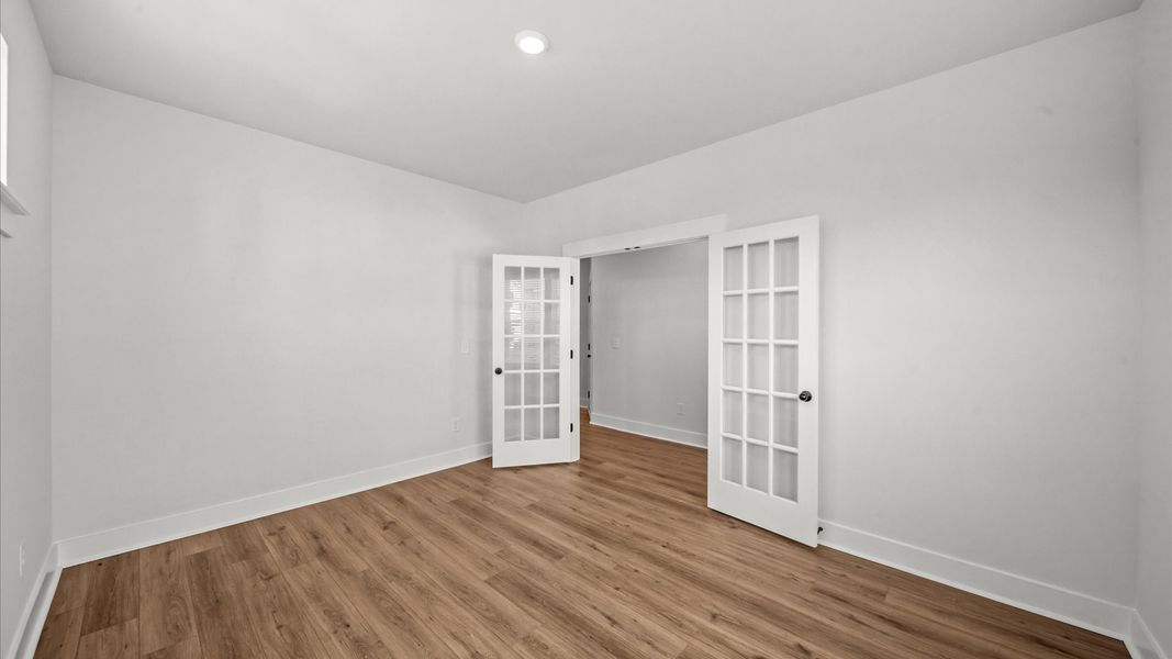 French door study adds functional elegance to this thoughtfully designed DRB Homes layout