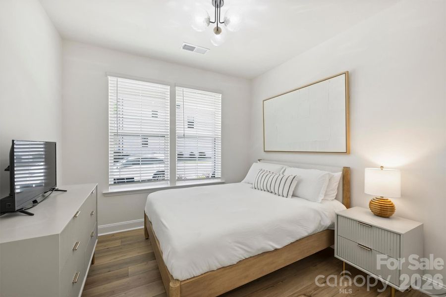 Main floor private guest suite or home office with full bath access — ideal for guests, multi-generational living, or a secluded workspace.