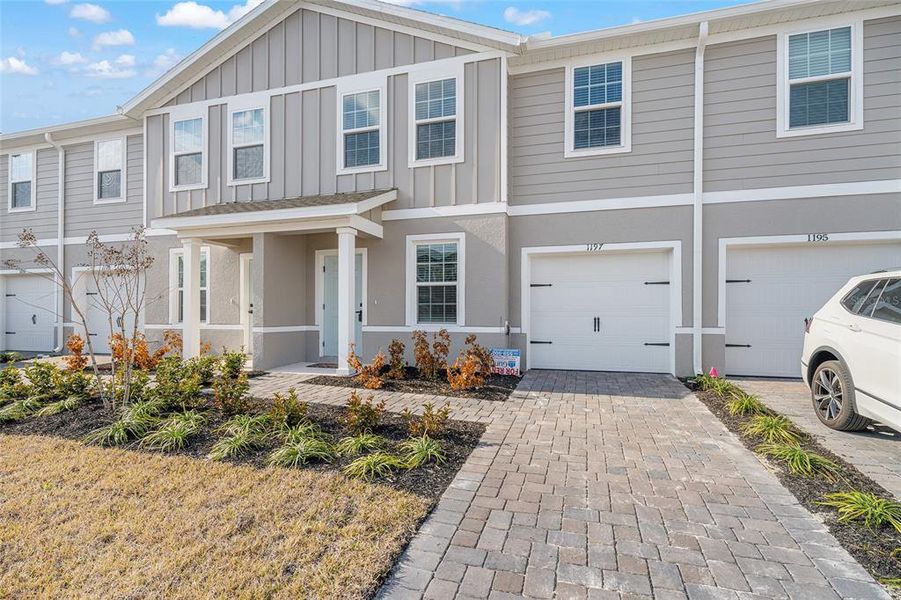 Front exterior of a new home in , Lady Lake, FL, highlighting curb appeal (Image 27). Front exterior of a new home in , Lady Lake, FL, highlighting curb appeal (Image 27).