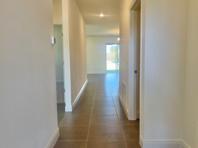 Spacious, unfurnished interior of a new home in Lakes At St Sebastian, Micco (Image 14).
