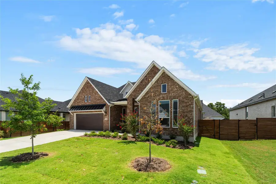 A well-maintained lawn welcomes you to this brick residence, featuring an attached garage and neatly landscaped surroundings. A well-maintained lawn welcomes you to this brick residence, featuring an attached garage and neatly landscaped surroundings.