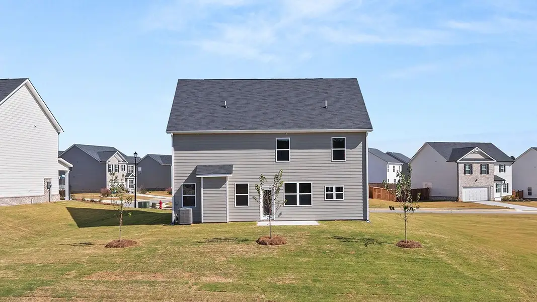 Exterior details and patio area of a home in Locust Grove Station - Cedar Ridge, Locust Grove (Image 2).