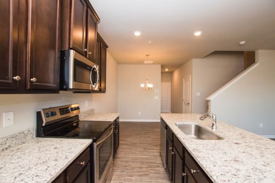 Representative furnished interior of a home built from the Cadence Unit A by Piedmont Residential in Ross Pointe, Kennesaw (Image 7).