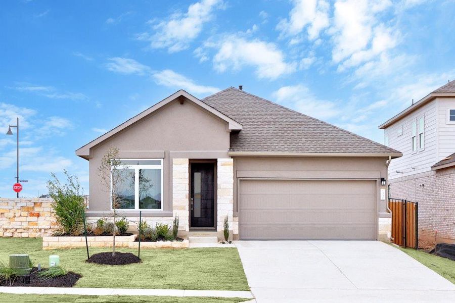 Front exterior of a new home in Santa Rita Ranch, Liberty Hill, TX, highlighting curb appeal (Image 16). Front exterior of a new home in Santa Rita Ranch, Liberty Hill, TX, highlighting curb appeal (Image 16).