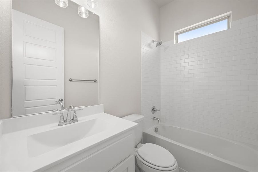 Bathroom featuring vanity and shower / bath combination