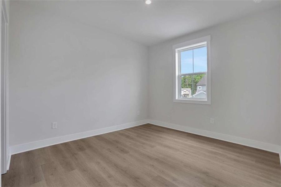 Spacious, unfurnished interior of a new home in The Paddocks at Doc Hughes, Buford (Image 32).