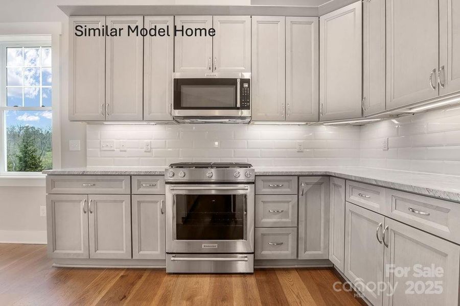 Gas range with vented microwave Gas range with vented microwave