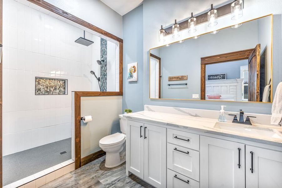 Bathroom with a walk in shower and double vanity