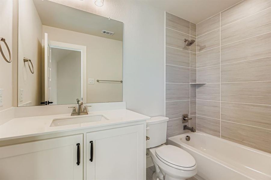 Bathroom featuring shower / bathtub combination and vanity