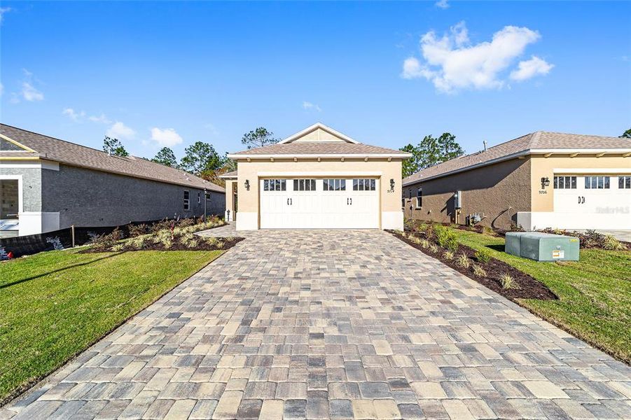 Front exterior of a new home in , Ocala, FL, highlighting curb appeal (Image 17). Front exterior of a new home in , Ocala, FL, highlighting curb appeal (Image 17).
