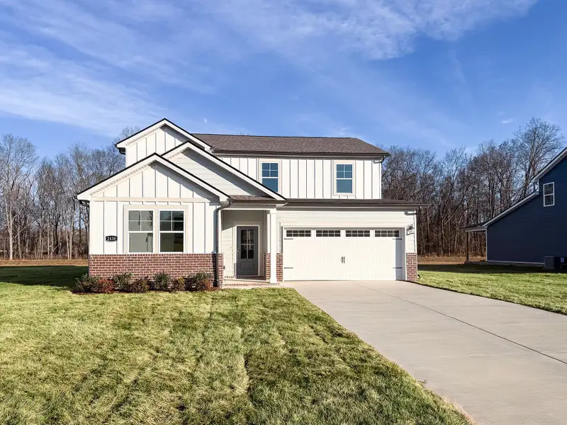 Front exterior of a new home in Highland Reserves, Pleasant View, TN, highlighting curb appeal (Image 1).
