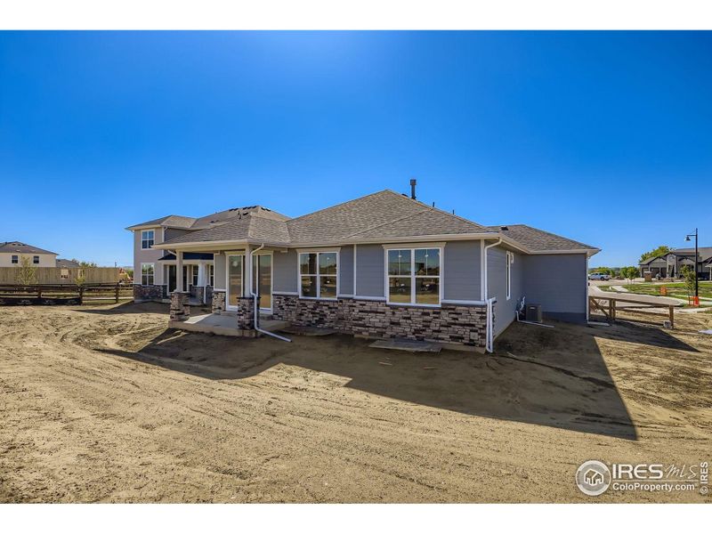 Exterior details and patio area of a home in Barefoot Lakes, Firestone (Image 2).