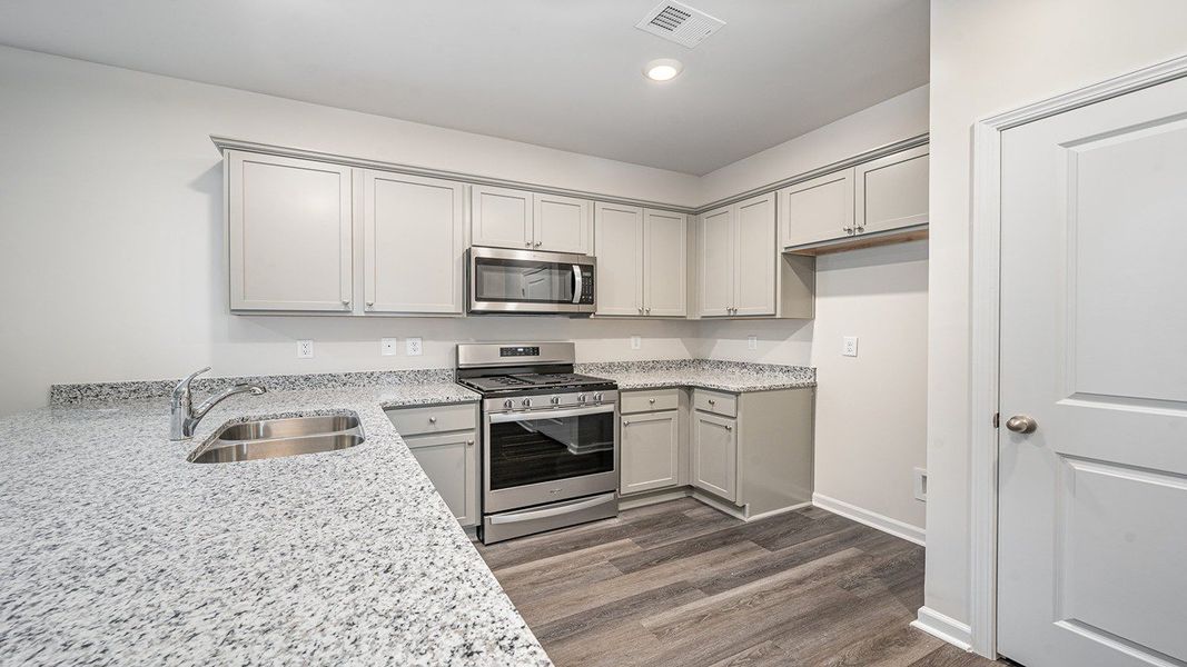 Representative furnished interior of a home built from the HELENA by D.R. Horton in Lochaven, Conway (Image 4).