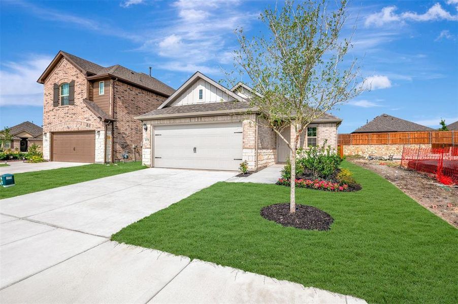 Front exterior of a new home in Elevon, Lavon, TX, highlighting curb appeal (Image 2). Front exterior of a new home in Elevon, Lavon, TX, highlighting curb appeal (Image 2).