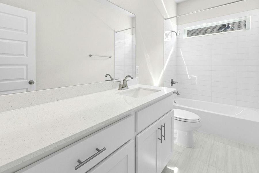 Full bath with vanity, shower / washtub combination, and light tile patterned floors