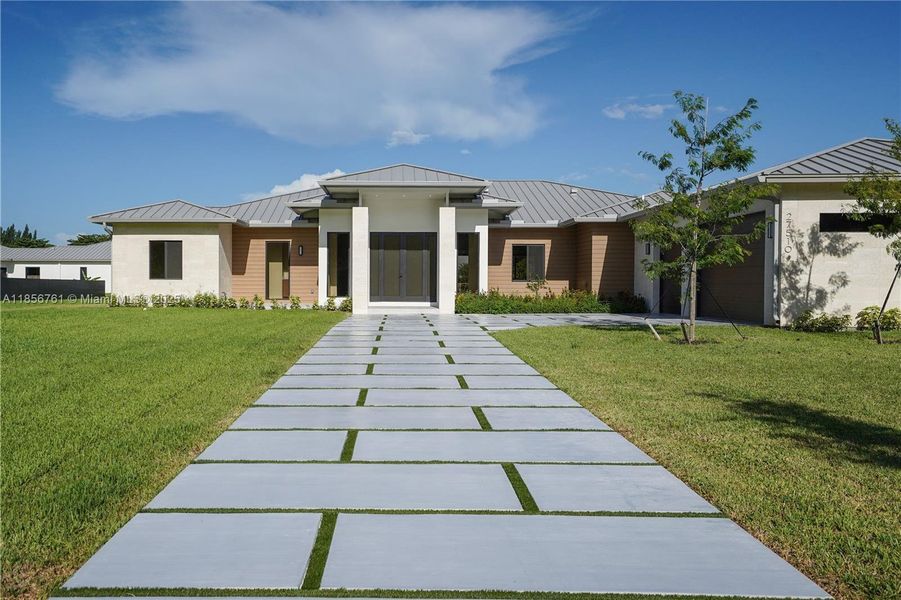 Front exterior of a new home in , Homestead, FL, highlighting curb appeal (Image 23).