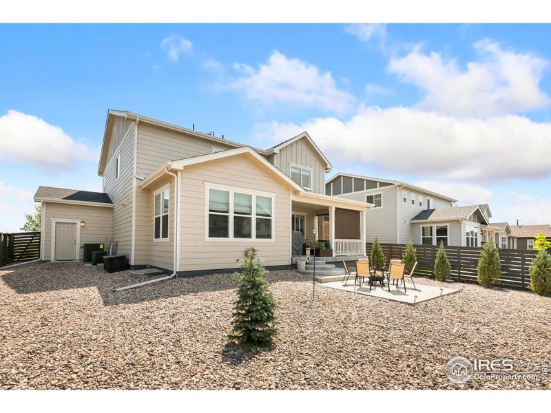 xeriscaped backyard with expanded patio