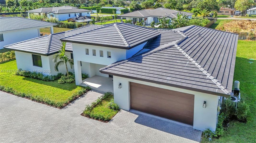 Front exterior of a new home in , Miami, FL, highlighting curb appeal (Image 25). Front exterior of a new home in , Miami, FL, highlighting curb appeal (Image 25).