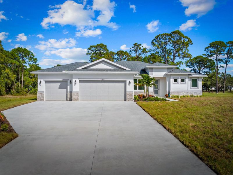 Front exterior of a new home in , Fort Pierce, FL, highlighting curb appeal (Image 1). Front exterior of a new home in , Fort Pierce, FL, highlighting curb appeal (Image 1).