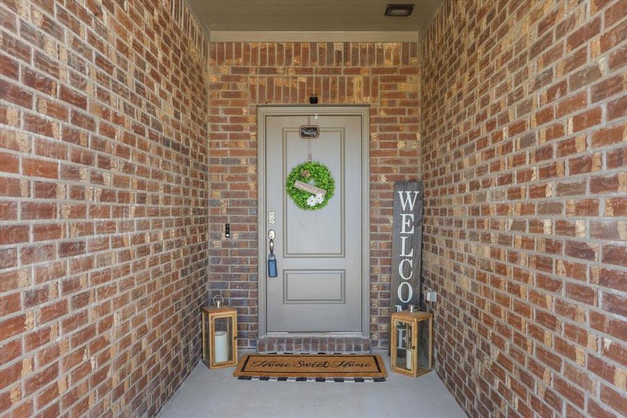 Doorway to property with brick siding Doorway to property with brick siding