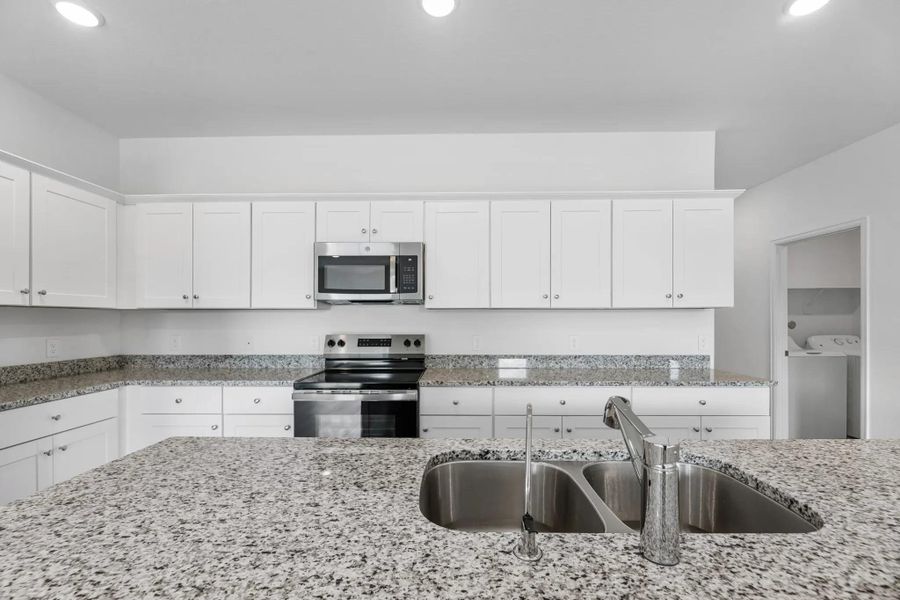 Furnished interior view inside a new home in Royal Pines, Porter (Image 5).