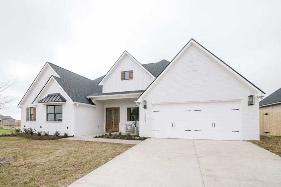 Representative exterior photo of a completed home built from the The Sophie by Reece Homes in Harvest Meadows, Bryan, TX (Image 1). Representative exterior photo of a completed home built from the The Sophie by Reece Homes in Harvest Meadows, Bryan, TX (Image 1).