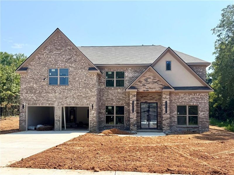 Front exterior of a new home in , Covington, GA, highlighting curb appeal (Image 1). Front exterior of a new home in , Covington, GA, highlighting curb appeal (Image 1).