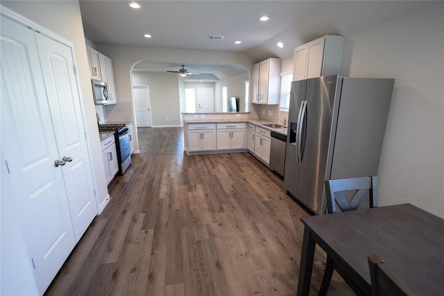 Dining area adjacent to the kitchen, offers the perfect spot for sharing meals with your loved ones.