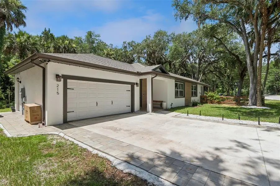 Front exterior of a new home in , Debary, FL, highlighting curb appeal (Image 1). Front exterior of a new home in , Debary, FL, highlighting curb appeal (Image 1).