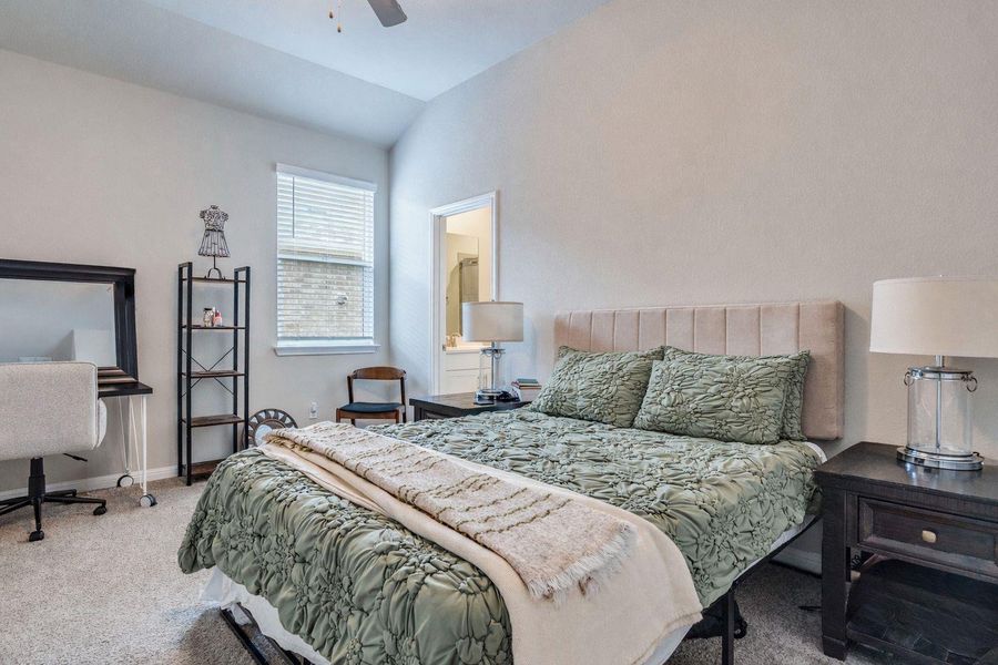 Second guest bedrooom includes walk in closet, vaulted ceilings ensuite private full bathroom access.