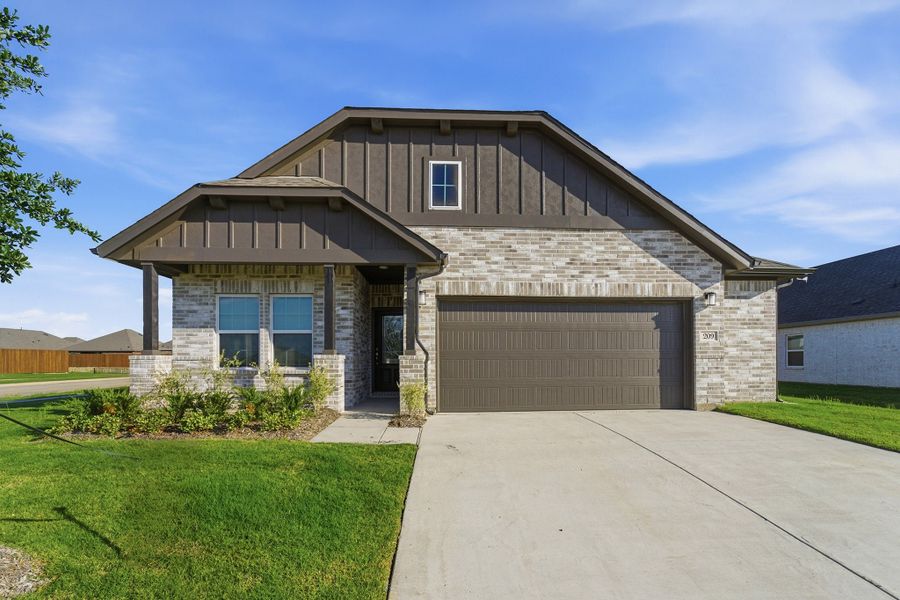 Front exterior of a new home in Saddlebrook Estates, Waxahachie, TX, highlighting curb appeal (Image 1). Front exterior of a new home in Saddlebrook Estates, Waxahachie, TX, highlighting curb appeal (Image 1).