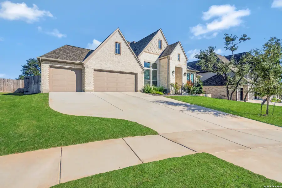 Front exterior of a new home in The Ranches at Creekside, Boerne, TX, highlighting curb appeal (Image 27). Front exterior of a new home in The Ranches at Creekside, Boerne, TX, highlighting curb appeal (Image 27).