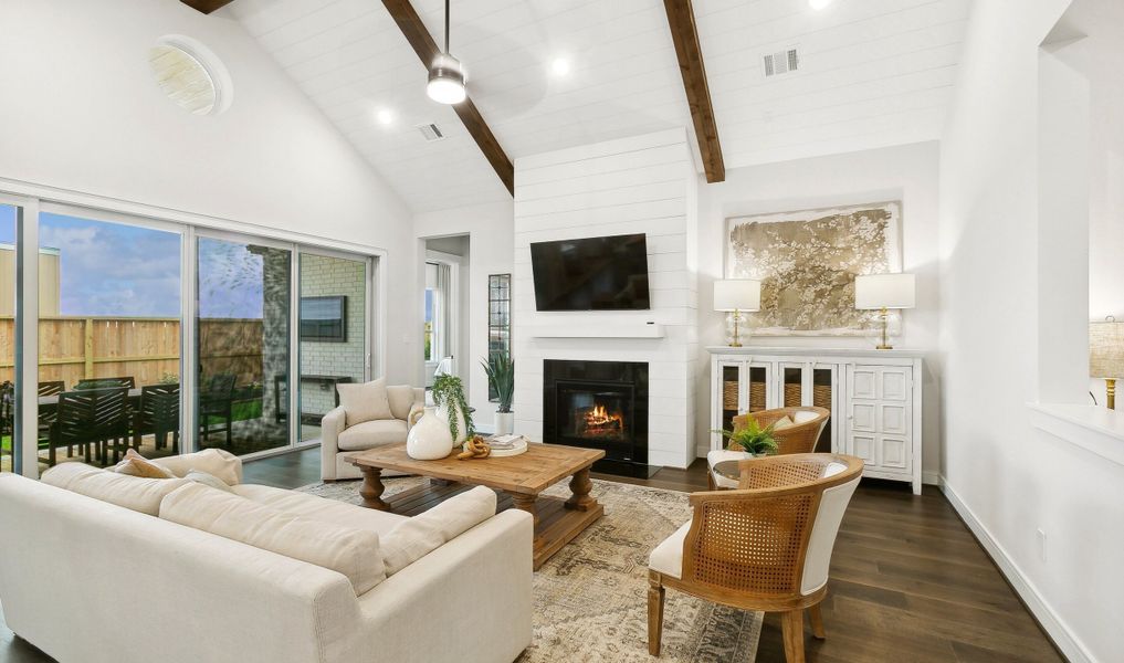 Great room with fireplace and stained ceiling beams