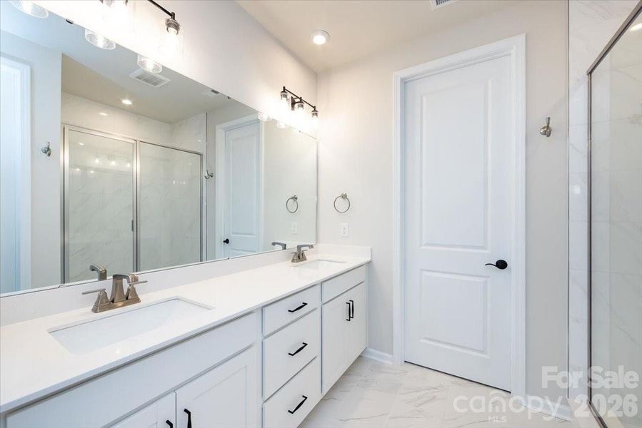 Primary Bathroom with Walk-In Closet