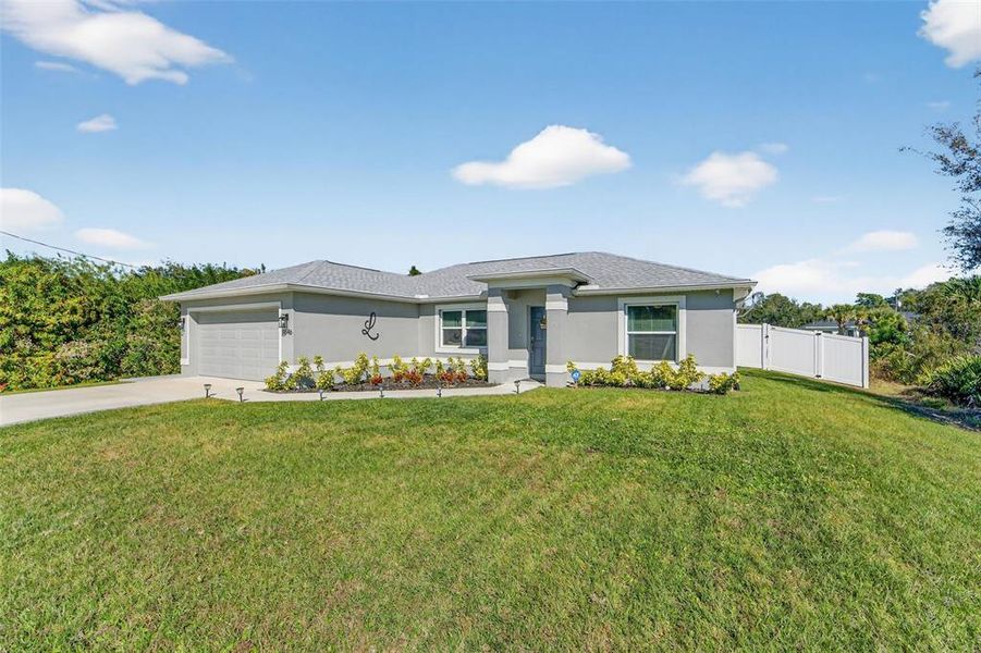 Front exterior of a new home in , North Port, FL, highlighting curb appeal (Image 21).
