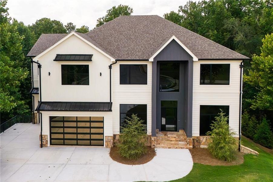 Front exterior of a new home in , Milton, GA, highlighting curb appeal (Image 26). Front exterior of a new home in , Milton, GA, highlighting curb appeal (Image 26).