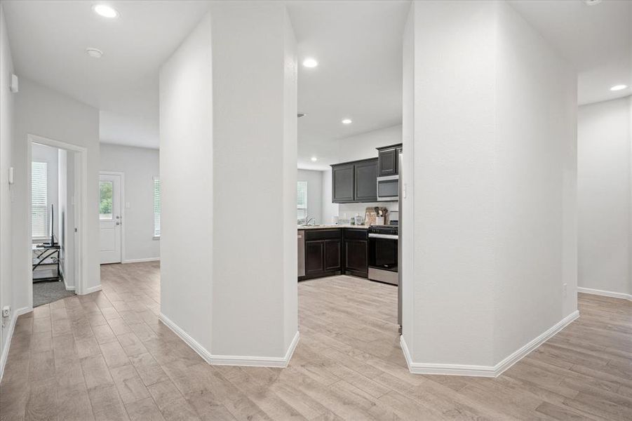Spacious bright entry Hallway featuring light wood finished floors and recessed lighting. Spacious bright entry Hallway featuring light wood finished floors and recessed lighting.