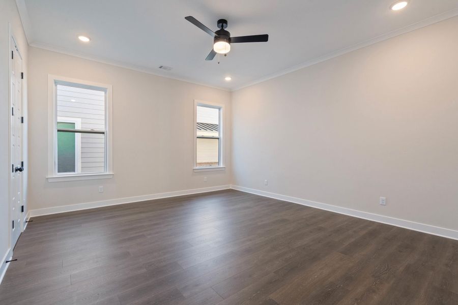 Unfurnished room featuring crown molding, dark wood finished floors, recessed lighting, and ceiling fan Unfurnished room featuring crown molding, dark wood finished floors, recessed lighting, and ceiling fan