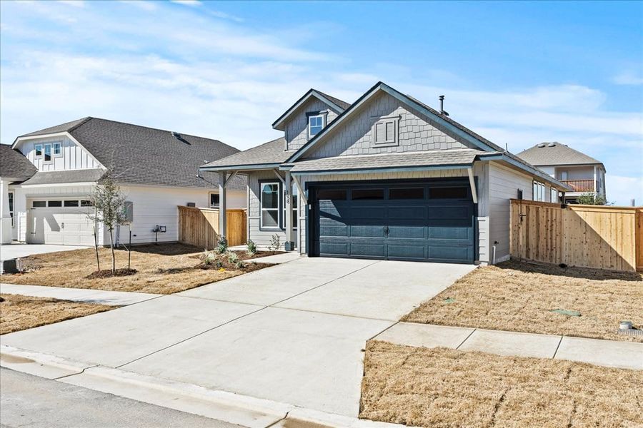 Front exterior of a new home in Trace, San Marcos, TX, highlighting curb appeal (Image 19).