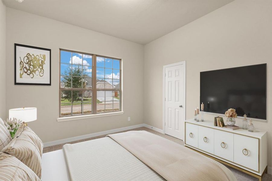 Your secondary bedroom features plush carpet, fresh paint, closet, and a large window that lets in plenty of natural lighting.