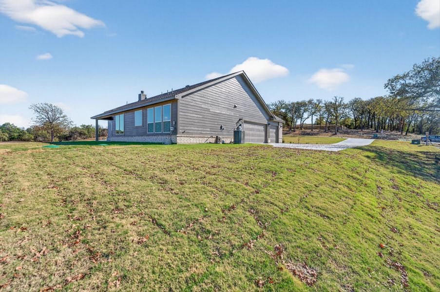 Exterior details and patio area of a home in Oak Grove Addition, Springtown (Image 32).