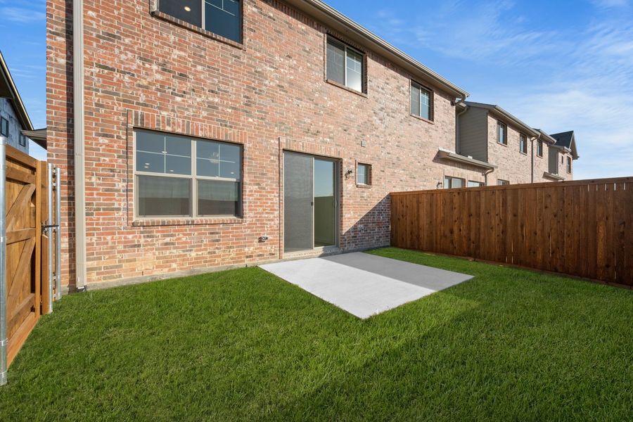 Exterior details and patio area of a home in Wildridge, Oak Point (Image 4).