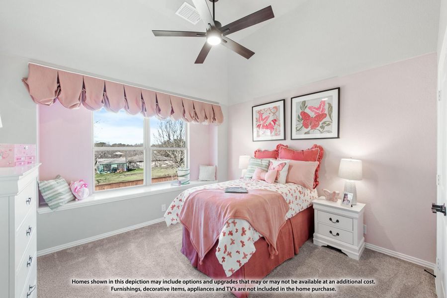 Children's bedroom with pink walls, ceiling fan, window seat, and carpeted floors