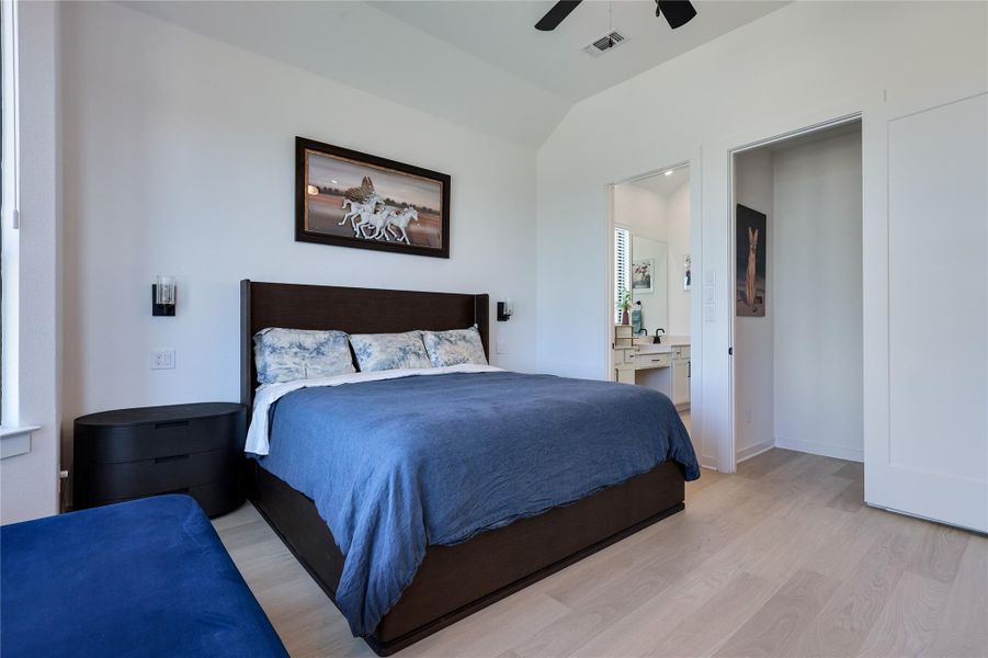 High ceilings and light wood floors elevate this restful bedroom retreat. High ceilings and light wood floors elevate this restful bedroom retreat.