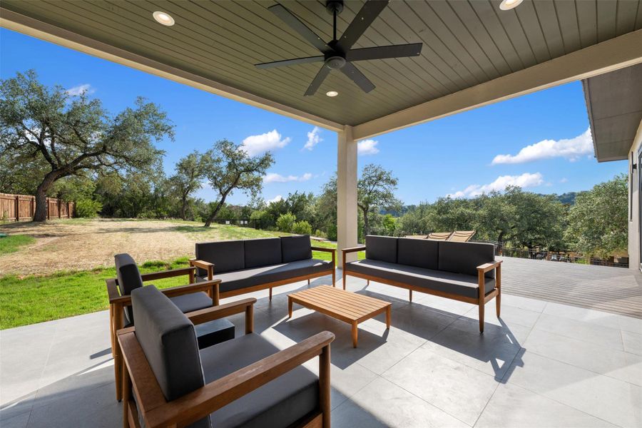 Covered patio off of family room with built-in grill, sink and cabinetry. Covered patio off of family room with built-in grill, sink and cabinetry.
