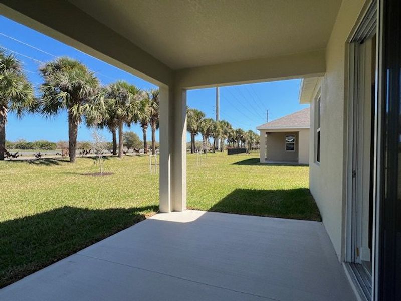 Exterior details and patio area of a home in Lakes At St Sebastian, Micco (Image 3).