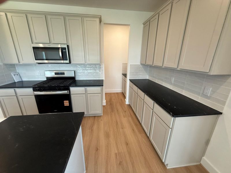 Step into this elegant kitchen, and you’ll find more than just a place to cook; you’ll discover a sanctuary that reflects your style and spirit.