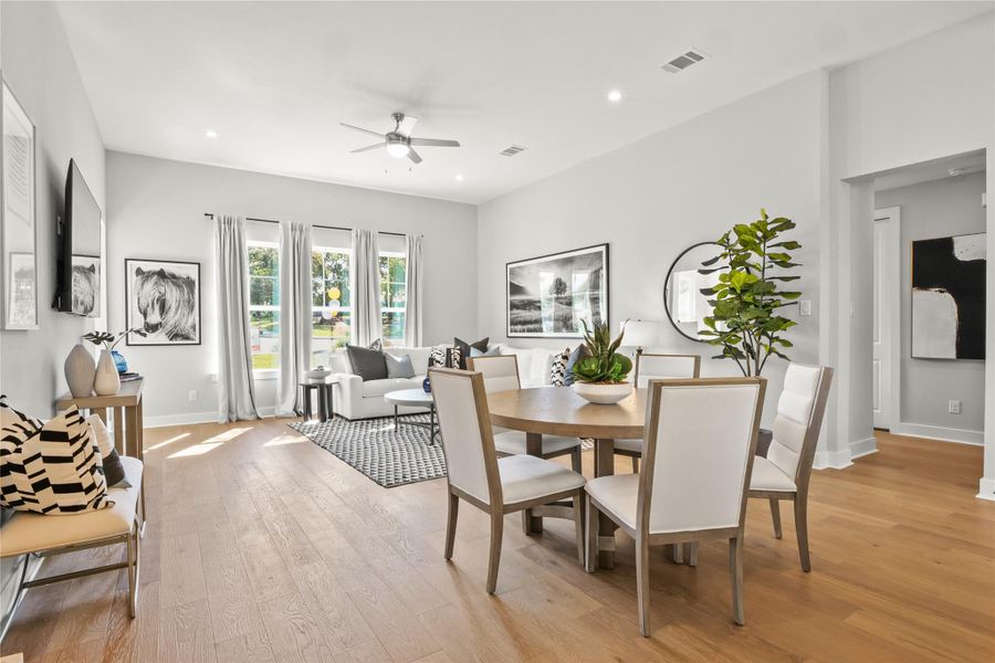 Dining space featuring light wood-style flooring, recessed lighting, and a ceiling fan Dining space featuring light wood-style flooring, recessed lighting, and a ceiling fan